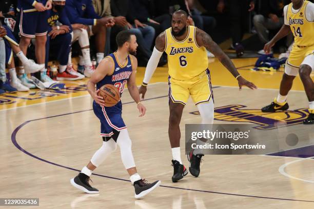 Golden State Warriors guard Stephen Curry guarded by Los Angeles Lakers forward LeBron James during the Golden State Warriors vs Los Angeles Lakers...