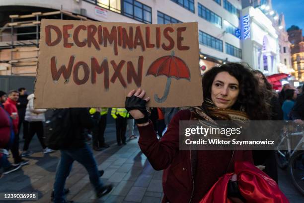 Woman holds a placard calling for decrminalisation of sex work during 'We Want to Live' demonstration held on International Women's Day on March 08,...