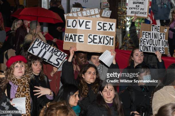 Women hold placards as they march during 'We Want to Live' demonstration held on International Women's Day on March 08, 2022 in London, England....