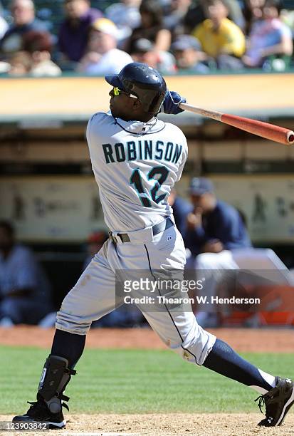 Trayvon Robinson of the Seattle Mariners bats against the Oakland Athletics during an MLB baseball game at O.co Coliseum on September 4, 2011 in...