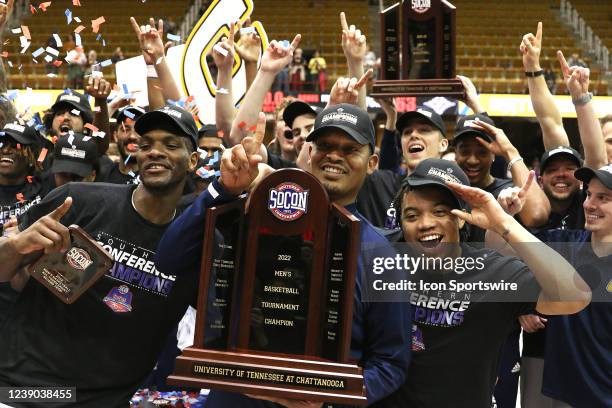 Chattanooga head coach Lamont Paris holds the trophy as the celebration begins during the Southern Conference Men's Basketball Championship game...