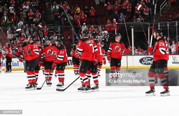 The New Jersey Devils salute the fans after defeating the Colorado Avalanche at Prudential Center on March 8, 2022 in Newark, New Jersey. The Devils...