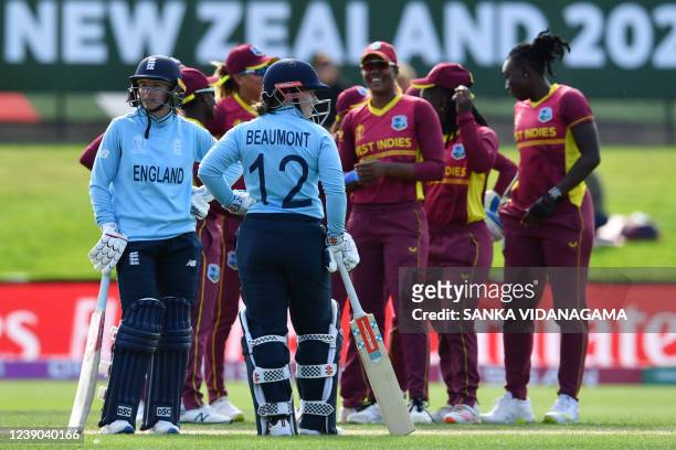 England's Tammy Beaumont and Danni Wyatt wait for the third umpire's decision during the Round 2 Women's Cricket World Cup match between England and...
