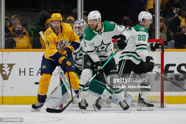 Filip Forsberg of the Nashville Predators and Jani Hakanpaa of the Dallas Stars watch the puck on its way into the net for a Predators goal during...