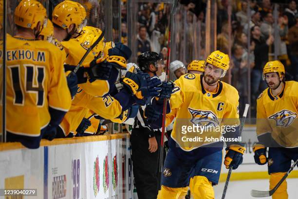 Roman Josi of the Nashville Predators is congratulated by teammates after scoring the go ahead goal against the Dallas Stars during the third period...