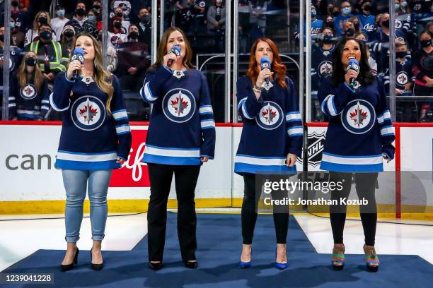 Winnipeg Jets anthem singers Sarah Baxter, Stacey Nattrass, Ashley Klimpke and Bev Wynne perform the National anthems prior to NHL action between the...