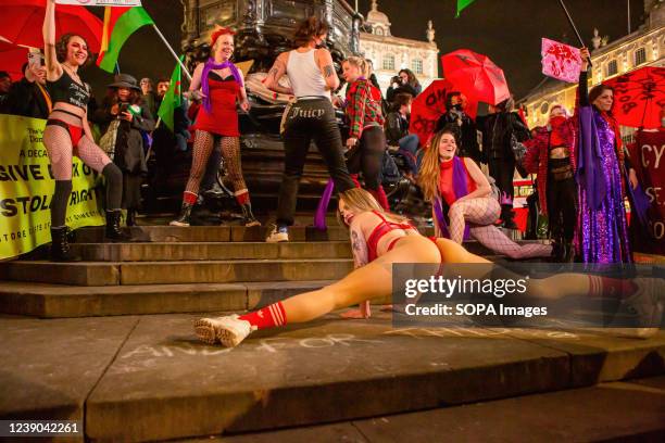 Dancers perform in Piccadilly Circus during a demonstration against discrimination of sex workers held on International Women's Day.On International...