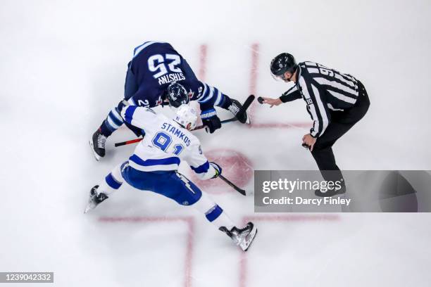 Paul Stastny of the Winnipeg Jets takes a second period face-off against Steven Stamkos of the Tampa Bay Lightning at the Canada Life Centre on March...