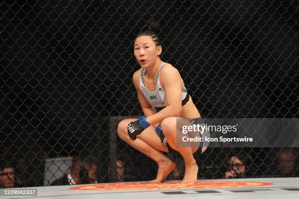 Yan Xiaonan reacts after receiving from Marina Rodriquez an illegal kick to the groin in their Womens Strawweight bout for UFC 272 on March 5 at...