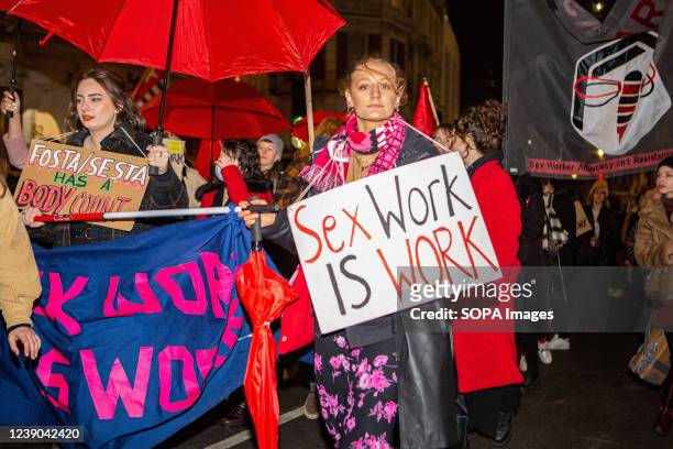 Activists hold placards that says "Sex work is work" during the SEX Work Strike on International Women's Day in Central London. On International...