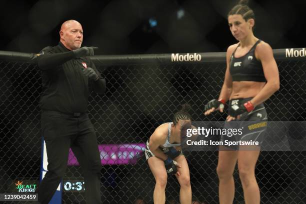 Marina Rodriquez reacts after kicking Yan Xiaonan with an illegal kick to the groin in their Womens Strawweight bout for UFC 272 on March 5 at...