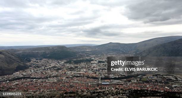 This photograph taken on February 19 shows a general view of the southern Bosnian city of Mostar. - In southern Bosnia's Mostar, the echo of church...