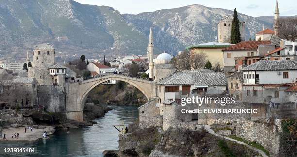 This photograph taken on February 19 shows a general view of the southern Bosnian city of Mostar. - In southern Bosnia's Mostar, the echo of church...