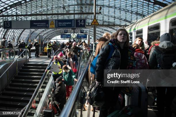 People fleeing war-torn Ukraine arrive on a train from Poland at the city's Hauptbahnhof main railway station on March 9, 2022 in Berlin, Germany....