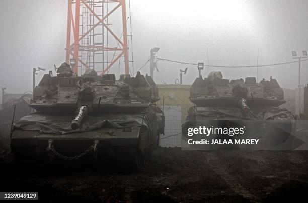 Merkava VI tanks are pictured at an Israeli military post near the Israeli-Syrian border on March 9 in the Israeli-annexed Golan Heights, a strategic...