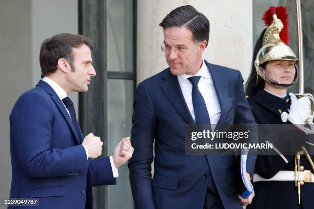 France's President Emmanuel Macron welcomes Netherlands' Prime Minister Mark Rutte before a working lunch about the Russian invasion of Ukraine, at...