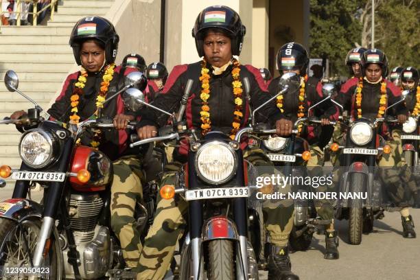 Indian Border Security Force personnel from women's motorcycle team 'Sema Bhawani' ride their Royal Enfield motorcycles during the BSF Seema Bhawani...