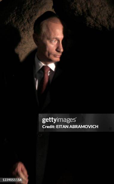 Russian President Vladimir Putin attends a ceremony at the Hall of Remembrance at Jerusalem's Yad Vashem Holocaust Memorial, 28 April 2005. Putin...