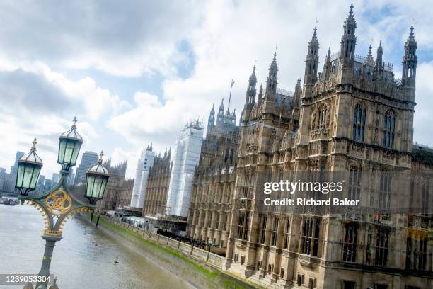 An unusial view of the Houses of Parliament, seen from a bus travelling across Westminster Bridge while construction sheeting is in place during its...