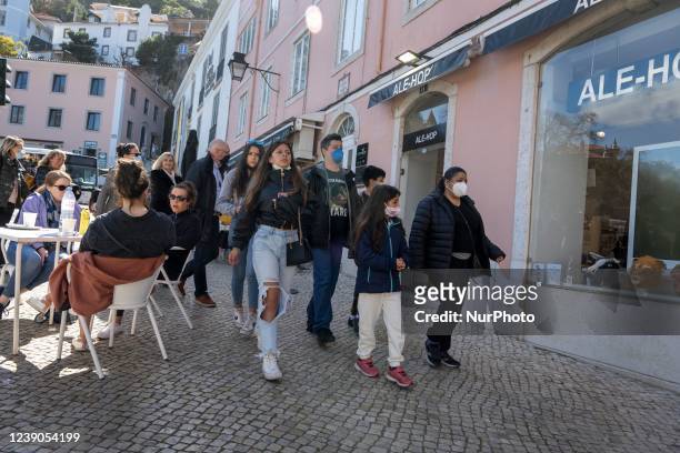 People wearing protective masks are seen walking around the historic center of Sintra. 28 February 2022. According to the General Health Direction...