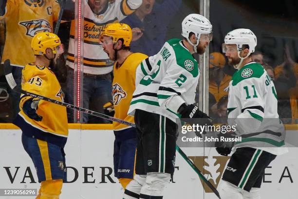 Alexandre Carrier and Ryan Johansen of the Nashville Predators react after scoring the game tying goal against the Dallas Stars during the third...