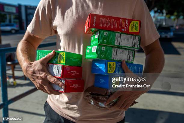 Josh Goldstein bought 10 boxes of Girls Scout cookies in the Mar Vista neighborhood at on Friday, Feb. 11, 2022 in Los Angeles, CA. He said he...