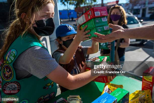 Madar Mee left, and Emma Diaz right, are selling Girl Scout Cookies in the Mar Vista neighborhood at on Friday, Feb. 11, 2022 in Los Angeles, CA....