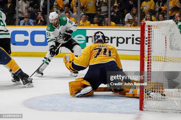 Tyler Seguin of the Dallas Stars takes a shot on goalie Juuse Saros of the Nashville Predators at Bridgestone Arena on March 08, 2022 in Nashville,...