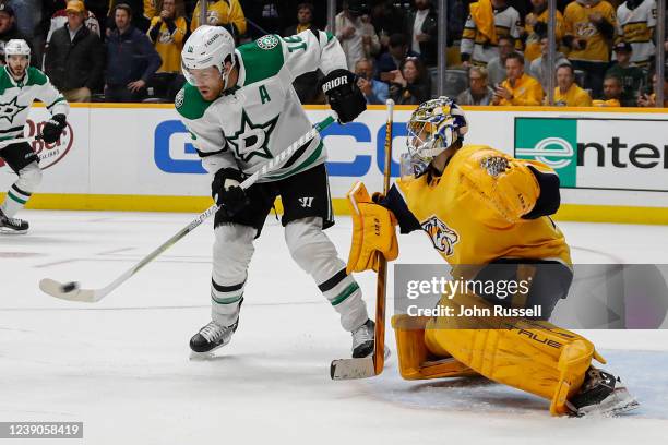 Joe Pavelski of the Dallas Stars deflects a shot on goalie Juuse Saros of the Nashville Predators at Bridgestone Arena on March 08, 2022 in...