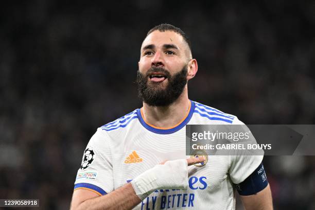 Real Madrid's French forward Karim Benzema celebrates after scoring a goal during the UEFA Champions League round of 16 second league football match...