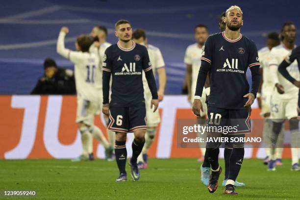 Paris Saint-Germain's Brazilian forward Neymar and Paris Saint-Germain's Italian midfielder Marco Verratti react after Real Madrid's French forward...