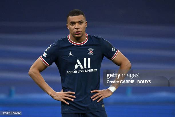 Paris Saint-Germain's French forward Kylian Mbappe reacts during the UEFA Champions League round of 16 second league football match between Real...