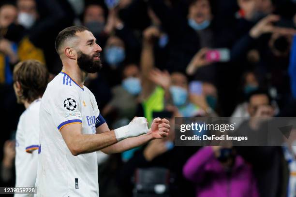 Karim Benzema of Real Madrid CF celebrates after scoring his team's third goal during the UEFA Champions League Round Of Sixteen Leg Two match...