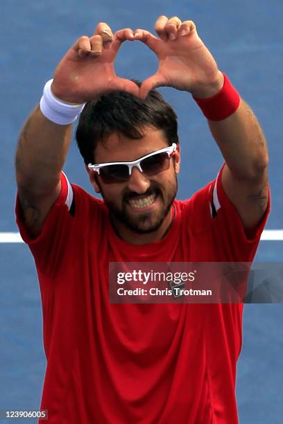 Janko Tipsarevic of Serbia celebrates defeating Juan Carlos Ferrero of Spain during Day Eight of the 2011 US Open at the USTA Billie Jean King...