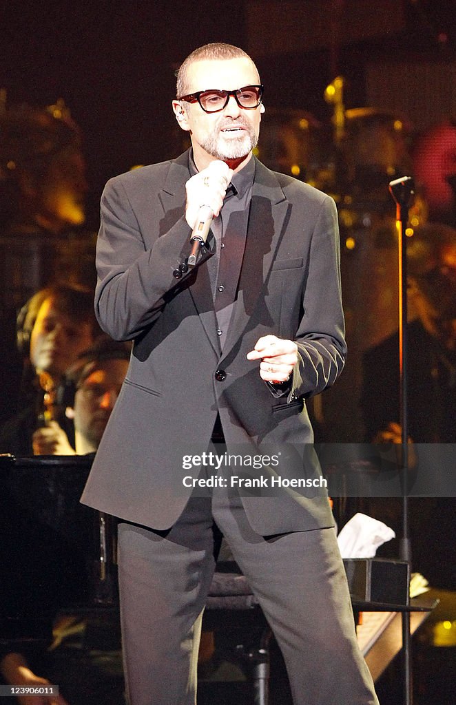 George Michael Instruments British singer George Michael performs live during a concert at the ...
