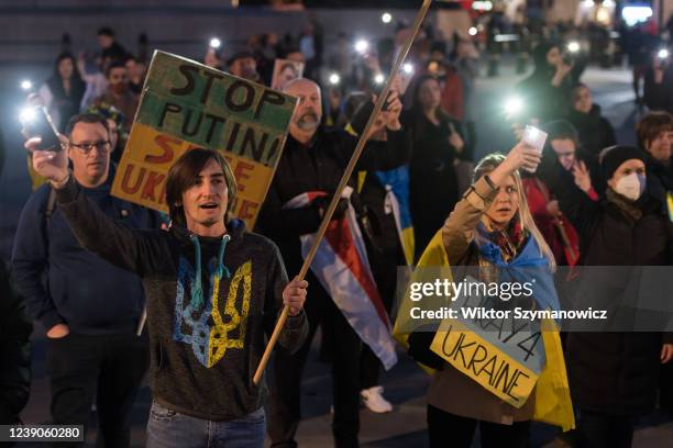 Demonstrators light up their phones during a protest in Trafalgar Square on the 14th day of Russian military invasion in Ukraine on March 09, 2022 in...