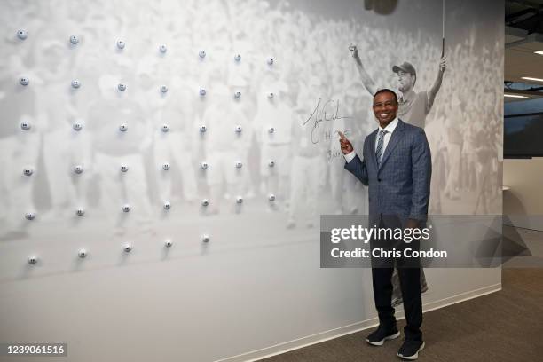 World Golf Hall of Fame inductee, Tiger Woods, signs a wall graphic of himself ahead of the World Golf Hall of Fame Induction Ceremony prior to THE...