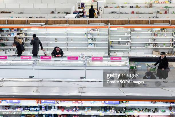 Empty shelves seen in a supermarket in the Ukrainian capital as the Russian invasion continues. Supermarkets are facing difficulties to restock as...