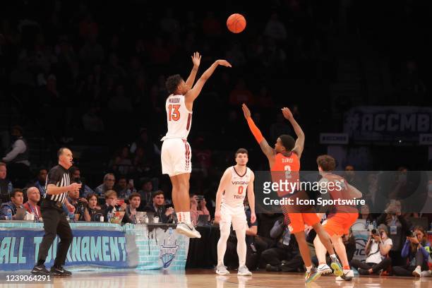 Virginia Tech Hokies guard Darius Maddox shoots and makes the game winning 3 point basket in overtime of the ACC Mens college basketball tournament...
