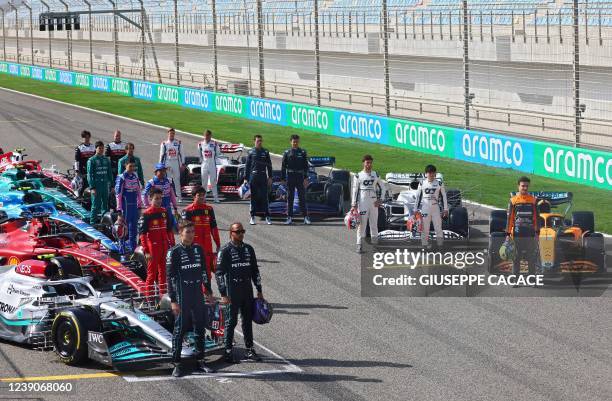 Drivers pose on the starting grid during the first day of Formula One pre-season testing at the Bahrain International Circuit in the city of Sakhir...