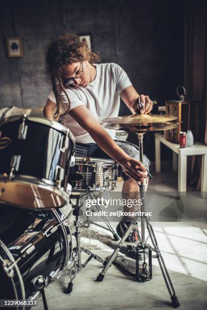 teenager playing rock and roll at home - practising stock pictures, royalty-free photos & images