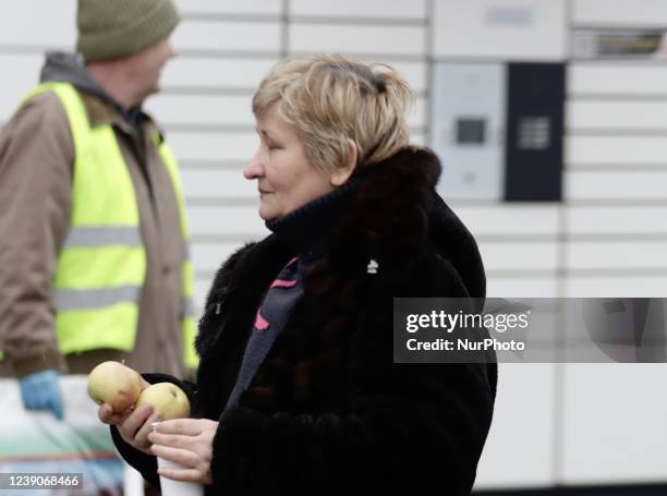 Refugees exit a bus arriving at the refugee camp ''Tesco'' or ''Industry'' of Przemysl, southeastern Poland, on March 3, 2022. More than one million...