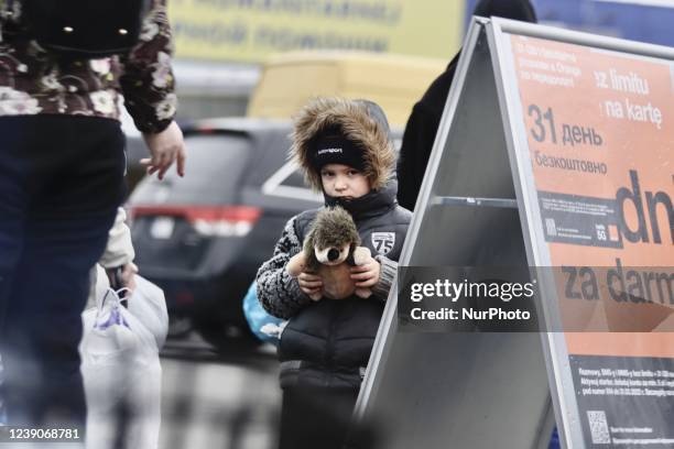 Refugees exit a bus arriving at the refugee camp ''Tesco'' or ''Industry'' of Przemysl, southeastern Poland, on March 3, 2022. More than one million...