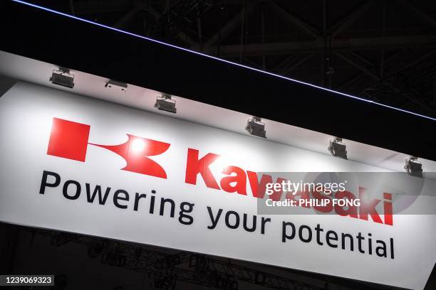 The logo of Kawasaki Heavy Industries Ltd. Is pictured at the International Robot Exhibition in Tokyo on March 10, 2022.