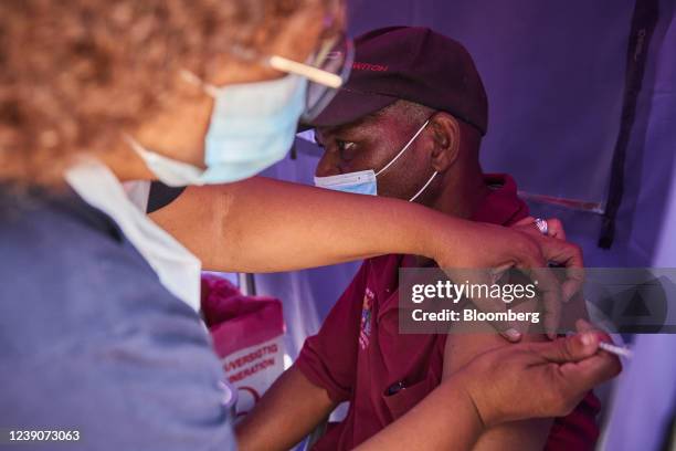 Health worker administers a Covid-19 vaccine during a rural vaccination drive by BroadReach Group, the public health implementation partner of the...