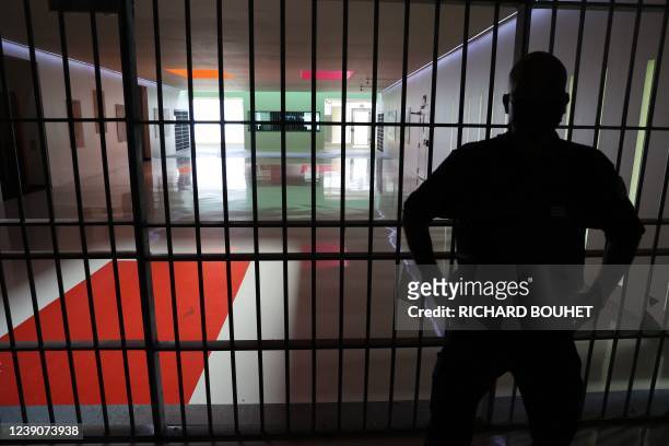 Prison guard stands in a corridor in the Domenjod prison in Saint-Denis, on the French Indian Ocean island of La Reunion, on March 10 during a visit...