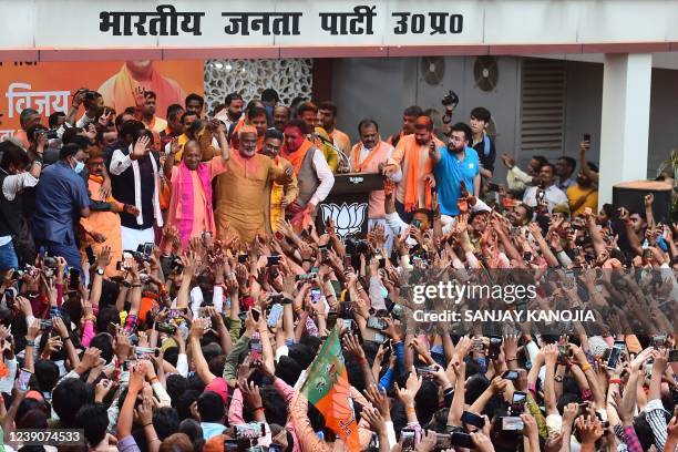Chief Minister of India's Uttar Pradesh state Yogi Adityanath gestures to his supporters after Bharatiya Janata Party's win in the state assembly...
