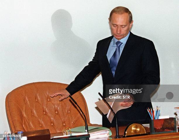 Russian Prime Minister Vladimir Putin arrives at his first cabinet meeting in Moscow 19 August 1999, after he met with President Boris Yeltsin. The...