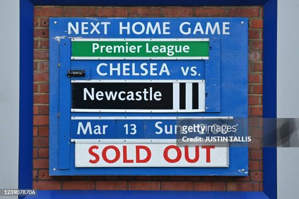 Sold out' sign is seen beside information on Chelsea's next home fixture outside Chelsea's stadium, Stamford Bridge in London on March 10 as...