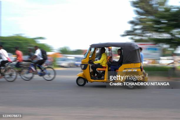 Tuk-tuk driver speeds through traffic in Bujumbura, on March 10, 2022. Burundi's Ministry of the Interior, Community Development and Public Security...